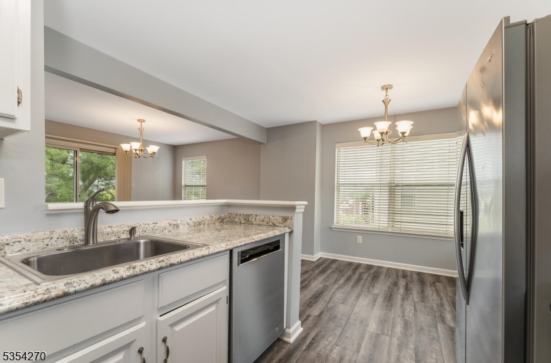 398 Terrace Lane Bedminster, NJ 07921 - Photo 11 of 31 a kitchen with granite countertop a sink and a window