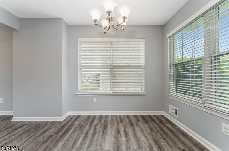 398 Terrace Lane Bedminster, NJ 07921 - Photo 13 of 31 a view of an empty room with wooden floor and a window