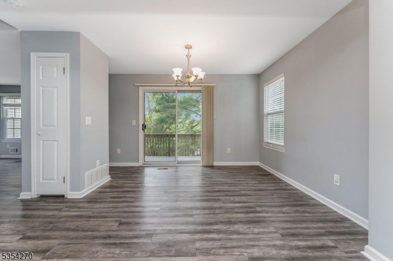 398 Terrace Lane Bedminster, NJ 07921 - Photo 16 of 31 a view of an empty room with wooden floor and a window