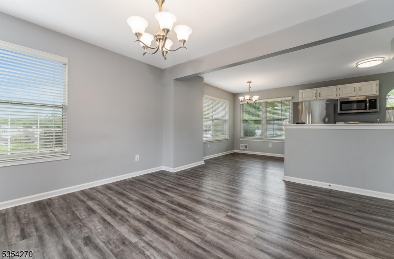 398 Terrace Lane Bedminster, NJ 07921 - Photo 17 of 31 a view of an empty room with wooden floor and a window