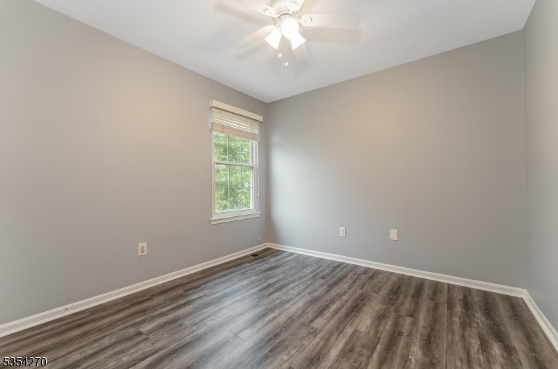 398 Terrace Lane Bedminster, NJ 07921 - Photo 22 of 31 wooden floor in an empty room with a window