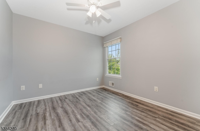 398 Terrace Lane Bedminster, NJ 07921 - Photo 23 of 31 wooden floor in an empty room with a window