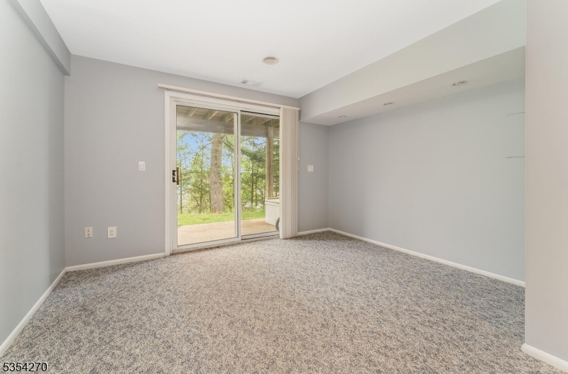 398 Terrace Lane Bedminster, NJ 07921 - Photo 27 of 31 a view of an empty room with a window