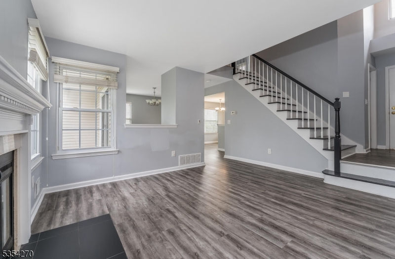 398 Terrace Lane Bedminster, NJ 07921 - Photo 6 of 31 a view of an empty room with wooden floor and a window