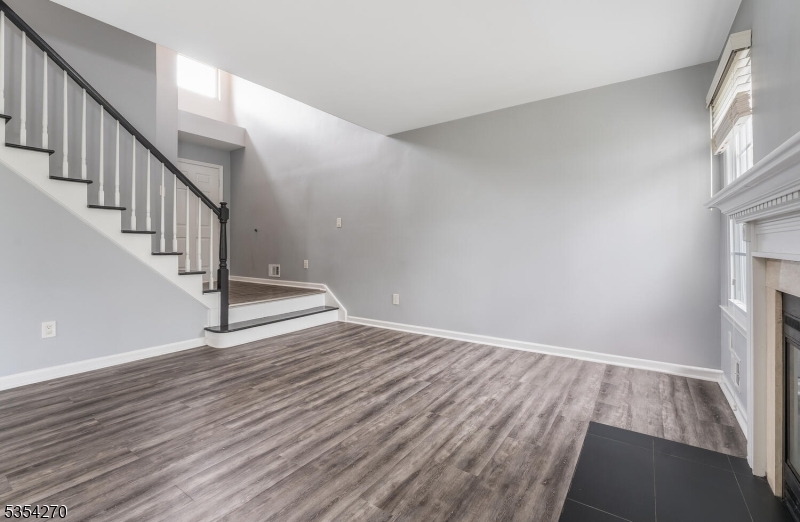 398 Terrace Lane Bedminster, NJ 07921 - Photo 7 of 31 a view of an empty room with wooden floor and a window
