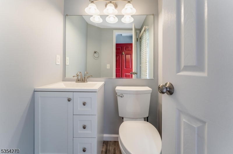 398 Terrace Lane Bedminster, NJ 07921 - Photo 8 of 31 a bathroom with a toilet sink and mirror