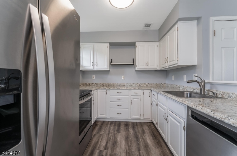 398 Terrace Lane Bedminster, NJ 07921 - Photo 9 of 31 a kitchen with a sink stove and refrigerator