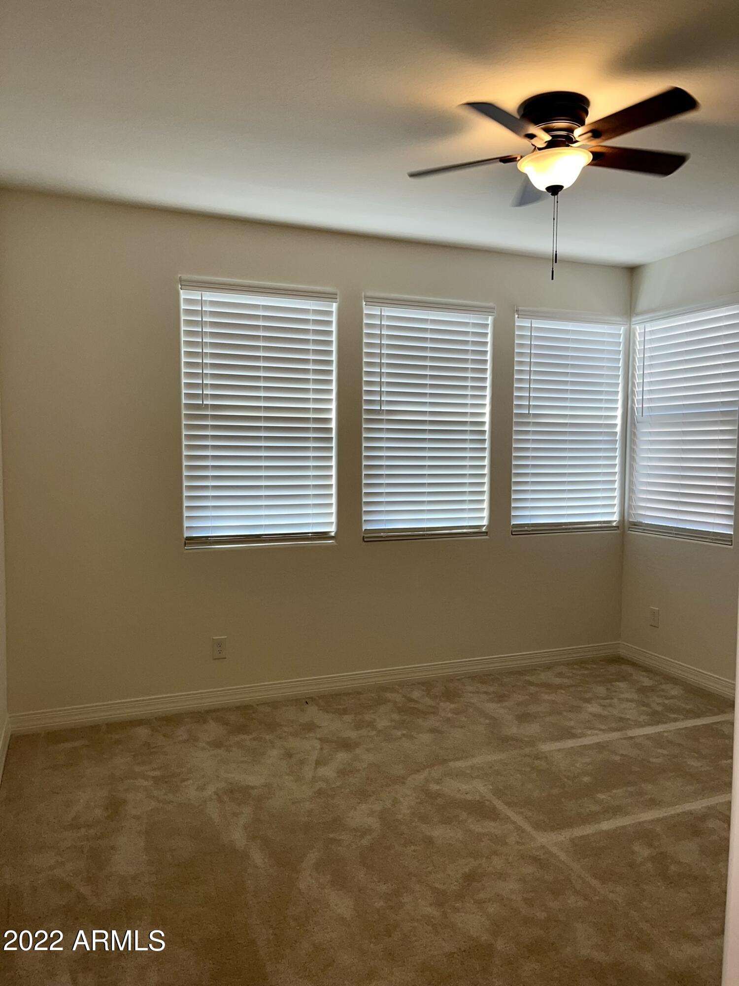 1737 East Hampton Lane Gilbert, AZ 85295 - Photo 3 of 15 a view of an empty room with a window