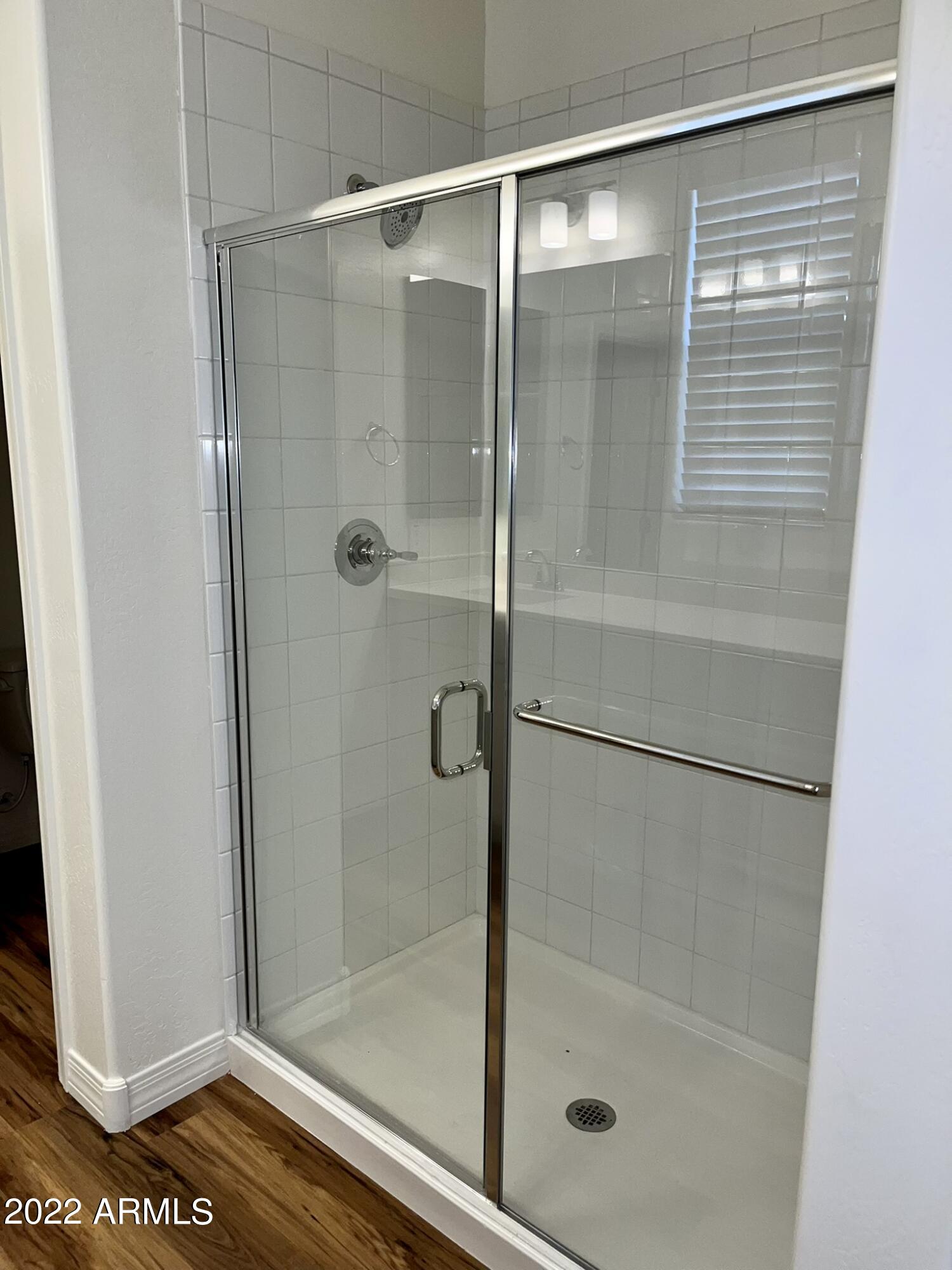 1737 East Hampton Lane Gilbert, AZ 85295 - Photo 5 of 15 a bathroom with a glass shower door