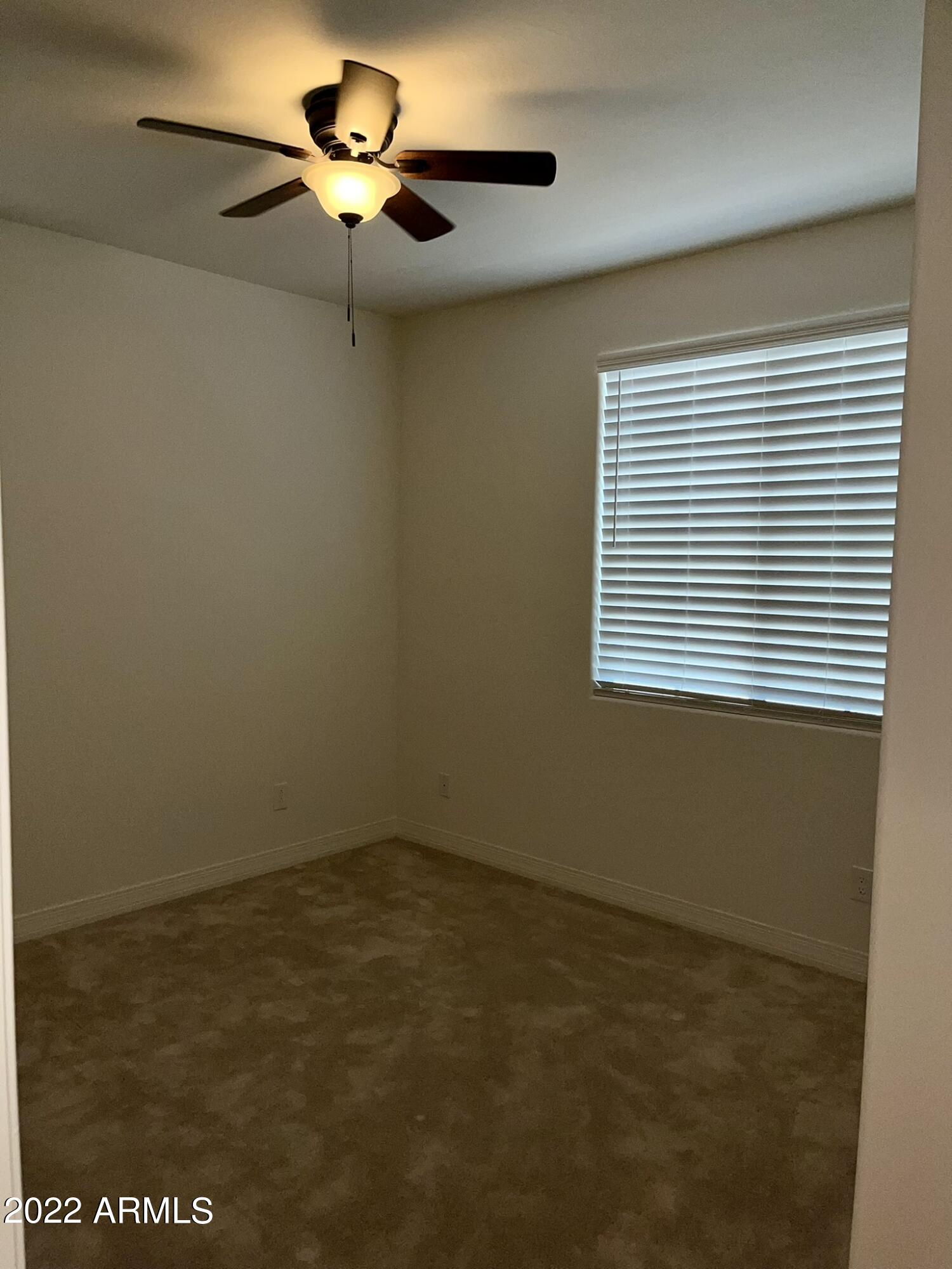 1737 East Hampton Lane Gilbert, AZ 85295 - Photo 8 of 15 an empty room with a window