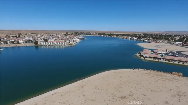 an aerial view of a house with a lake view