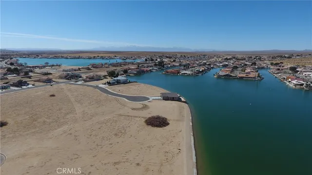 an aerial view of a house with a lake view
