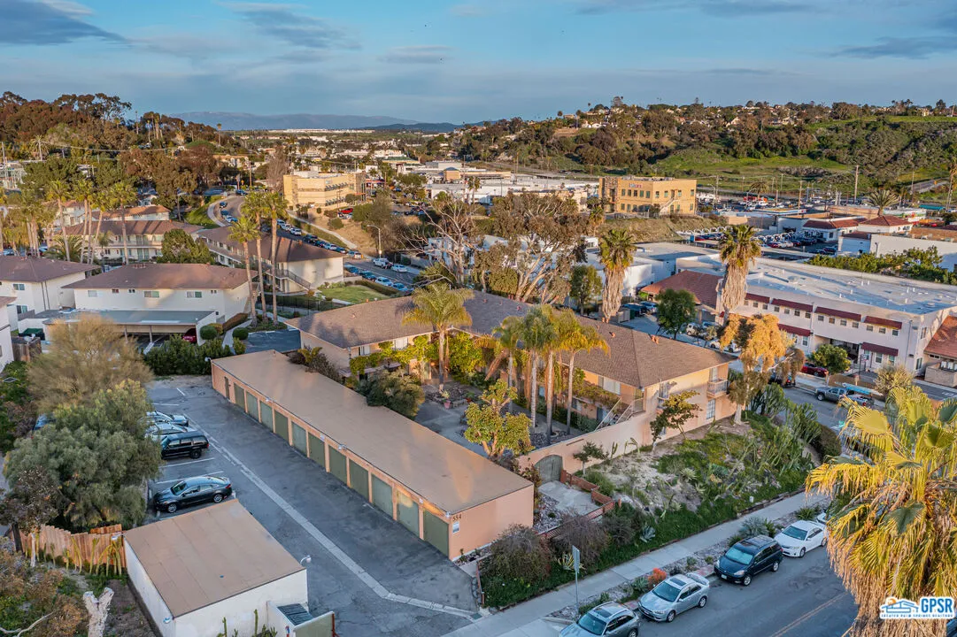an aerial view of residential houses with outdoor space