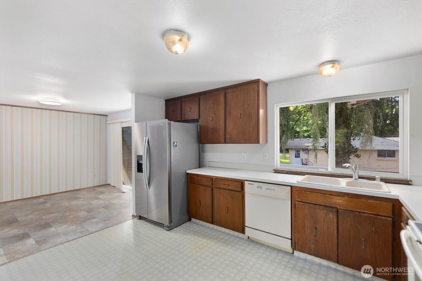 21627 9th Place West Bothell, WA 98021 - Photo 15 of 40 a kitchen with stainless steel appliances granite countertop a refrigerator and a sink