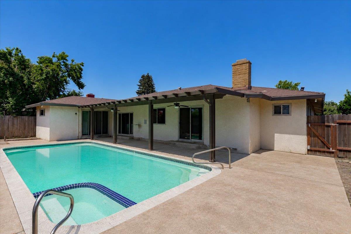69 Springbrook Circle Sacramento, CA 95831 - Photo 27 of 29 a view of a house with a swimming pool and a yard