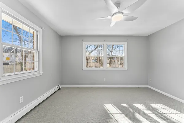 a view of room with window and ceiling fan