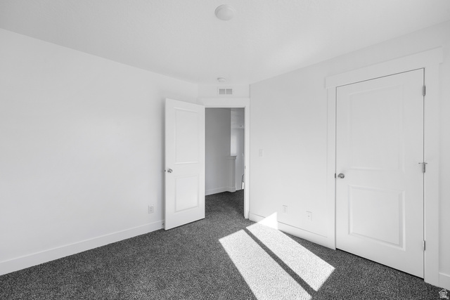 291 North Slant Road, Unit 46M Mapleton, UT 84660 - Photo 10 of 19 Unfurnished bedroom featuring dark colored carpet and baseboards