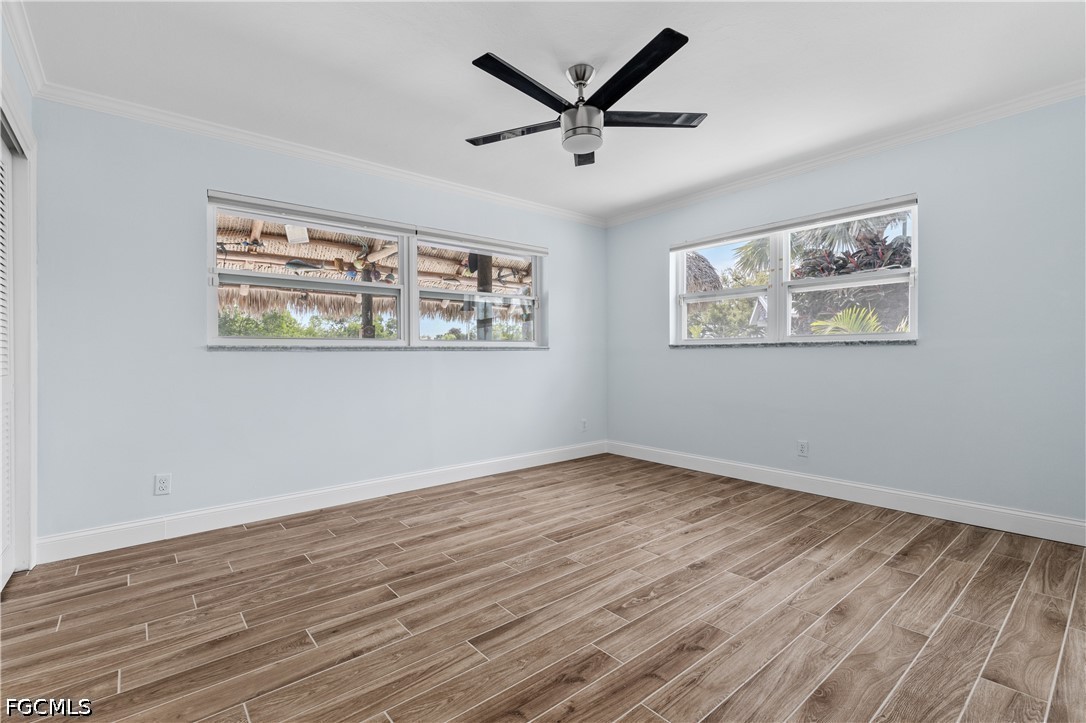 416 Seaworthy Road North Fort Myers, FL 33903 - Photo 15 of 30 a view of room with wooden floor and window