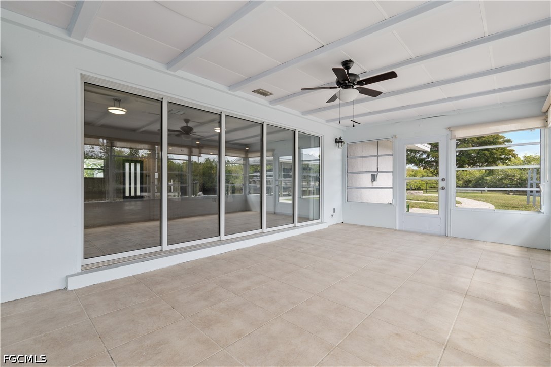 416 Seaworthy Road North Fort Myers, FL 33903 - Photo 22 of 30 a view of an empty room with a sliding door
