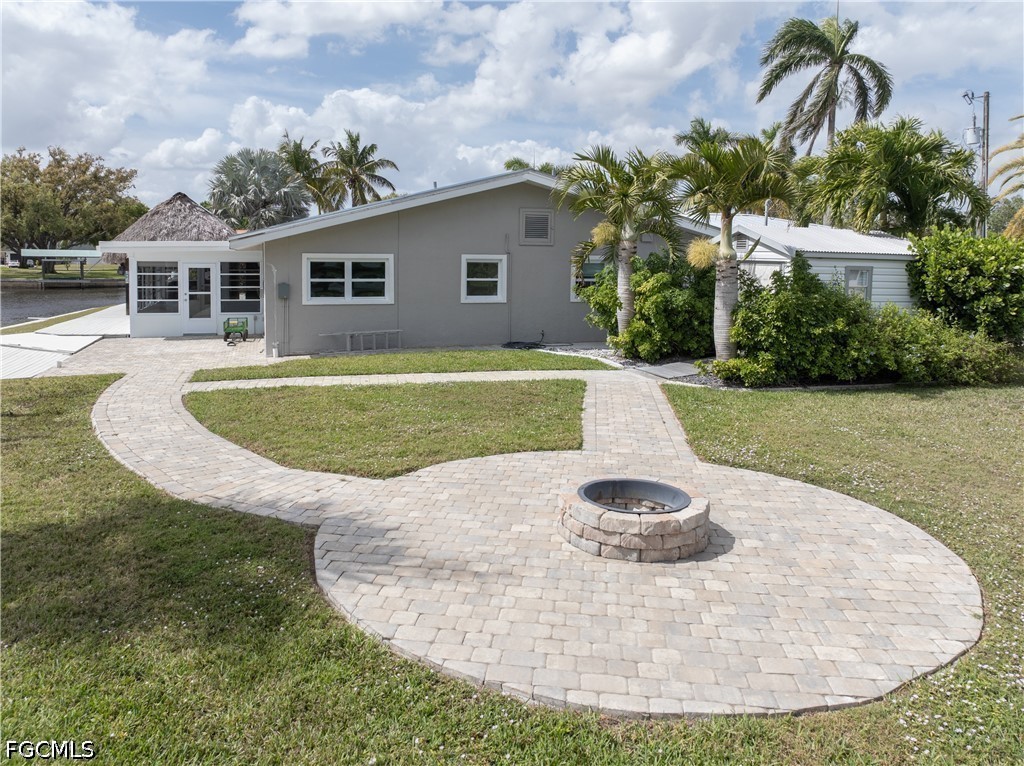 416 Seaworthy Road North Fort Myers, FL 33903 - Photo 25 of 30 a view of a house with a swimming pool