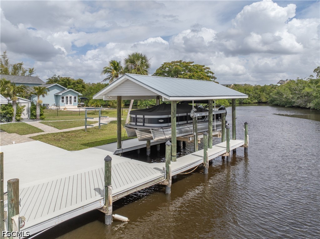 416 Seaworthy Road North Fort Myers, FL 33903 - Photo 26 of 30 a view of a house with yard and sitting area