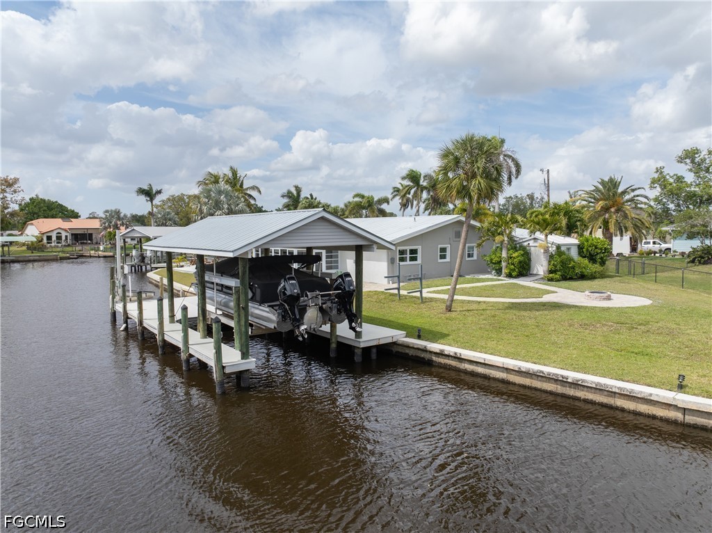 416 Seaworthy Road North Fort Myers, FL 33903 - Photo 28 of 30 a swimming pool with outdoor seating and yard