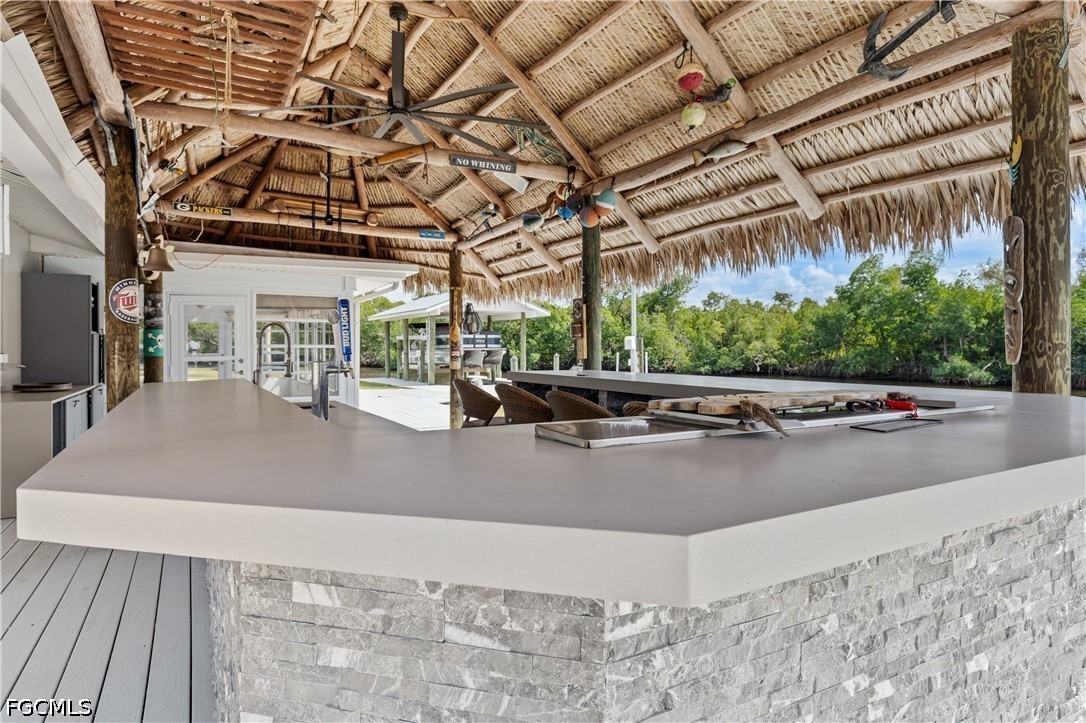 416 Seaworthy Road North Fort Myers, FL 33903 - Photo 5 of 30 a view of a patio with a table and chairs