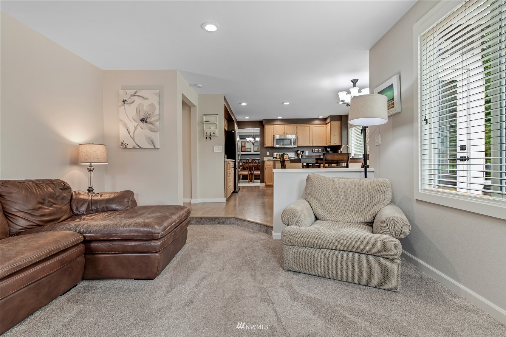 20909 33rd Avenue Southeast Bothell, WA 98021 - Photo 11 of 30 a living room with furniture and a kitchen