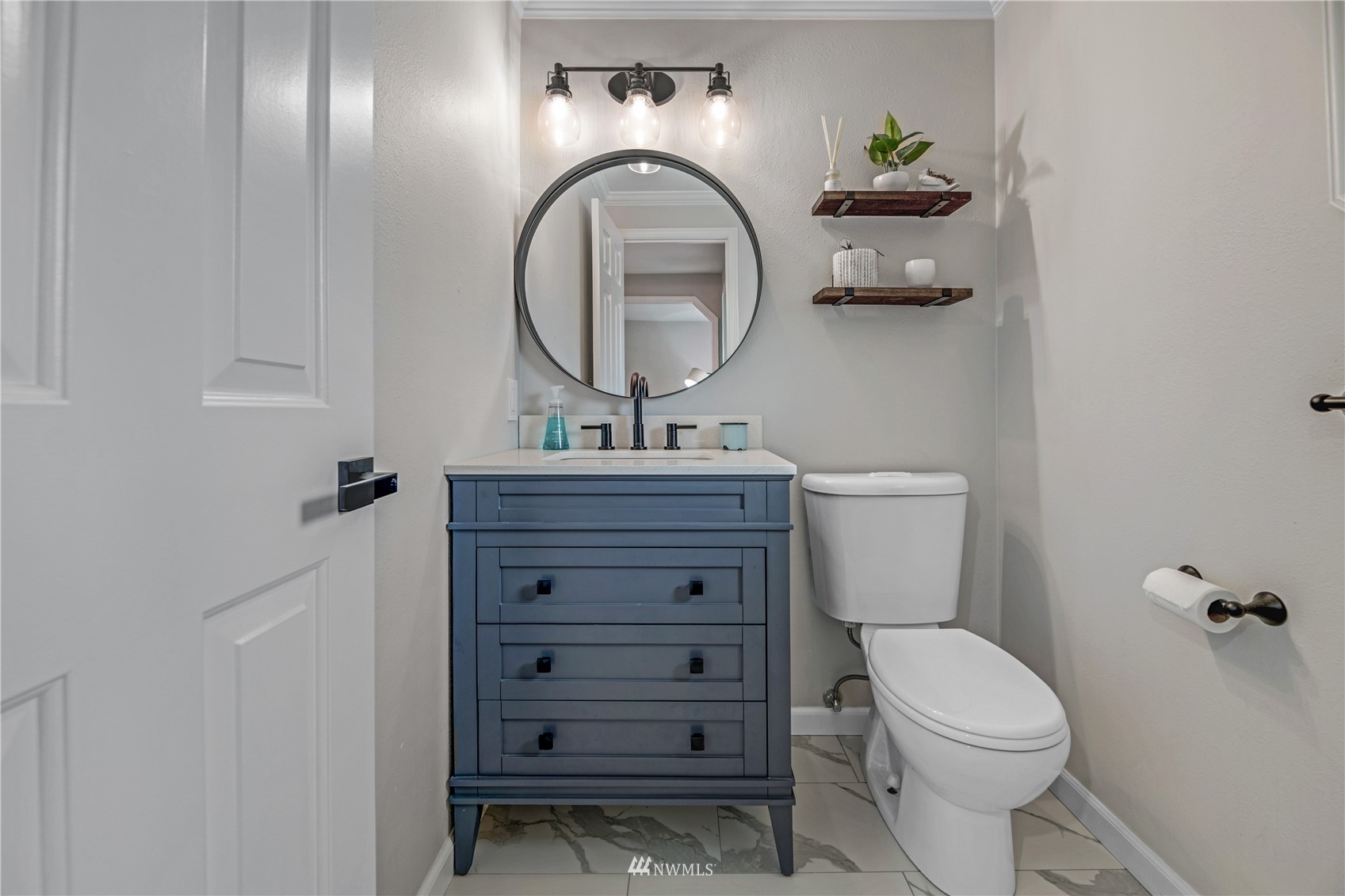 20909 33rd Avenue Southeast Bothell, WA 98021 - Photo 13 of 30 a bathroom with a toilet a sink and mirror