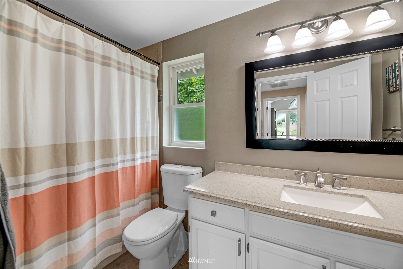 20909 33rd Avenue Southeast Bothell, WA 98021 - Photo 20 of 30 a bathroom with a granite countertop sink a toilet and a large mirror