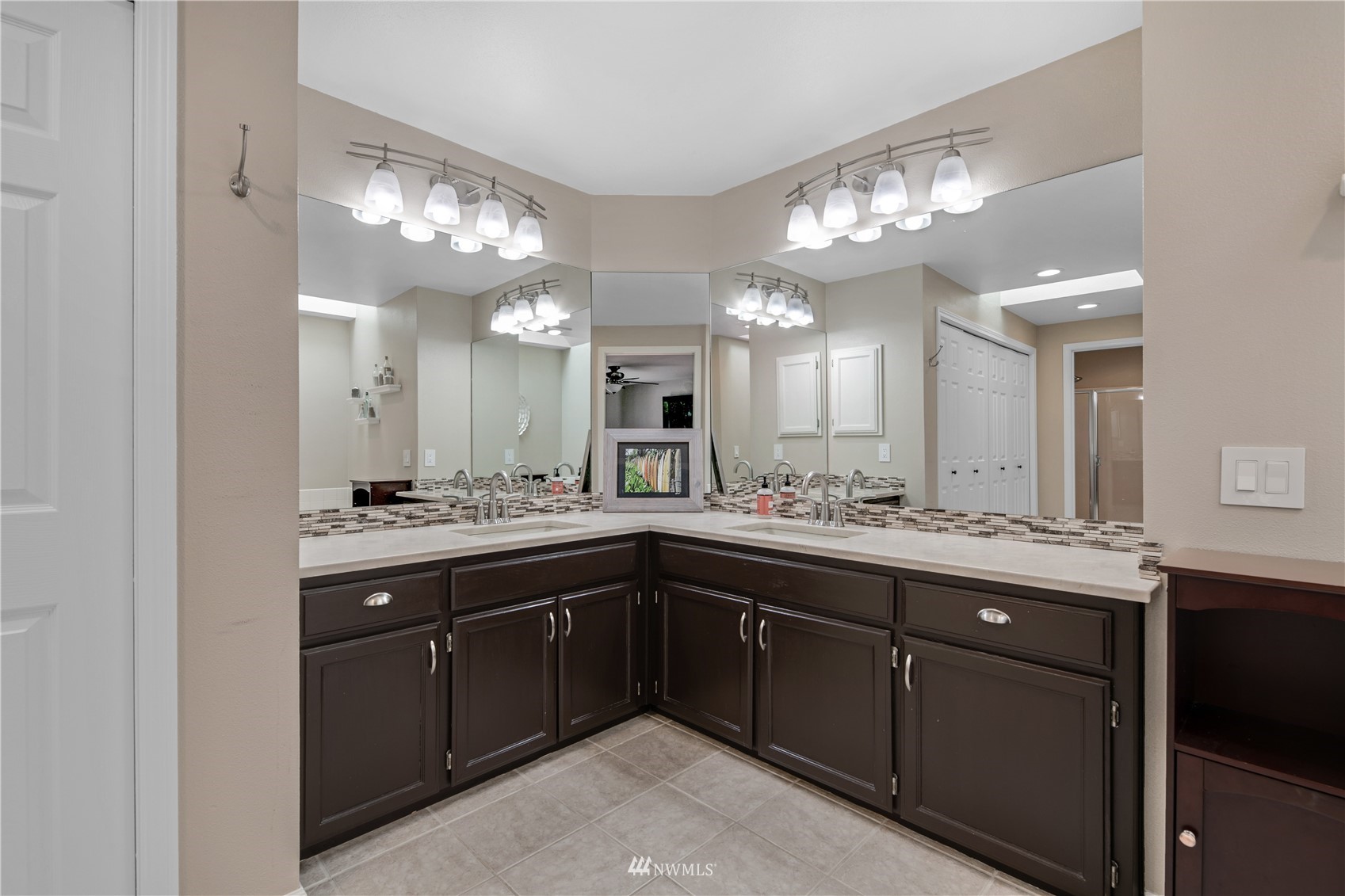 20909 33rd Avenue Southeast Bothell, WA 98021 - Photo 23 of 30 a spacious bathroom with a sink a large mirror and a shower