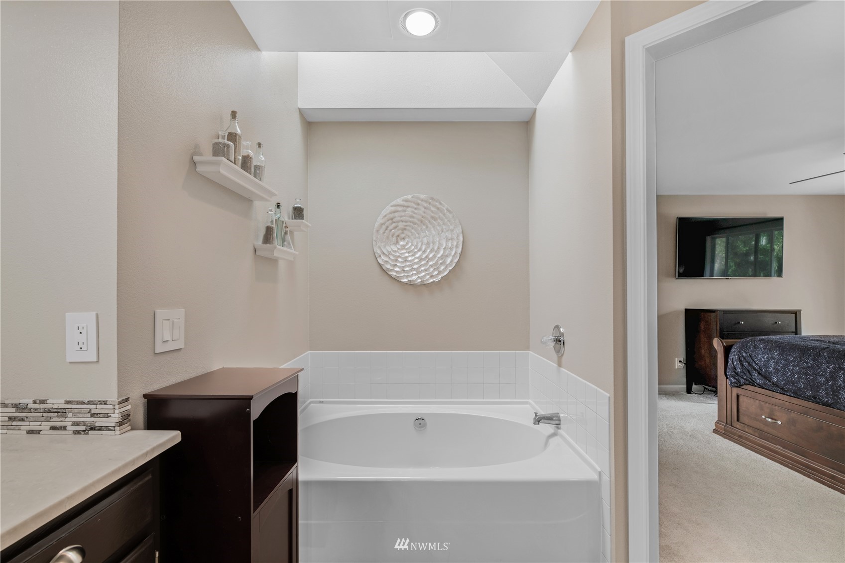 20909 33rd Avenue Southeast Bothell, WA 98021 - Photo 24 of 30 a bathroom with a tub sink and a mirror