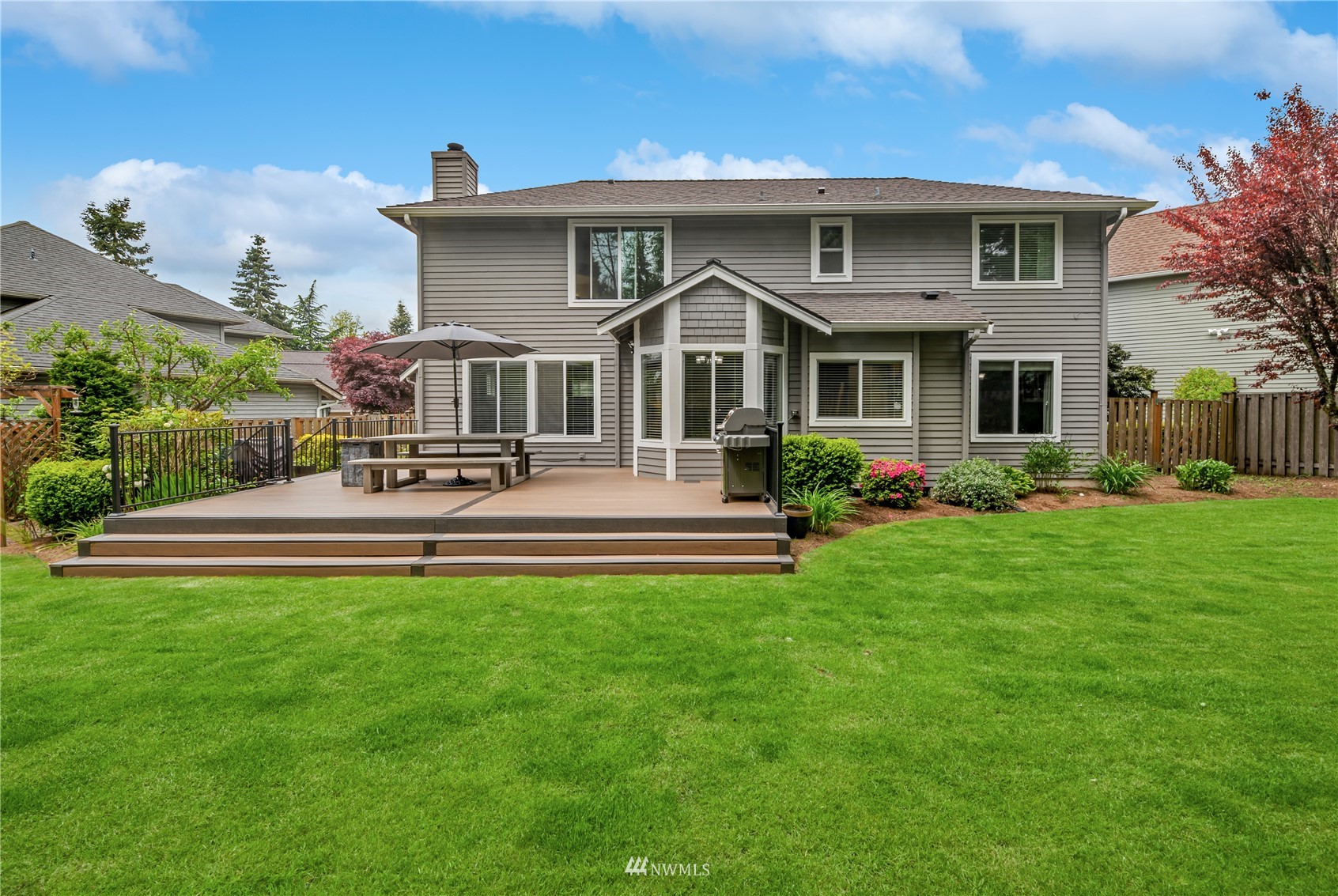 20909 33rd Avenue Southeast Bothell, WA 98021 - Photo 27 of 30 a front view of a house with a yard table and chairs
