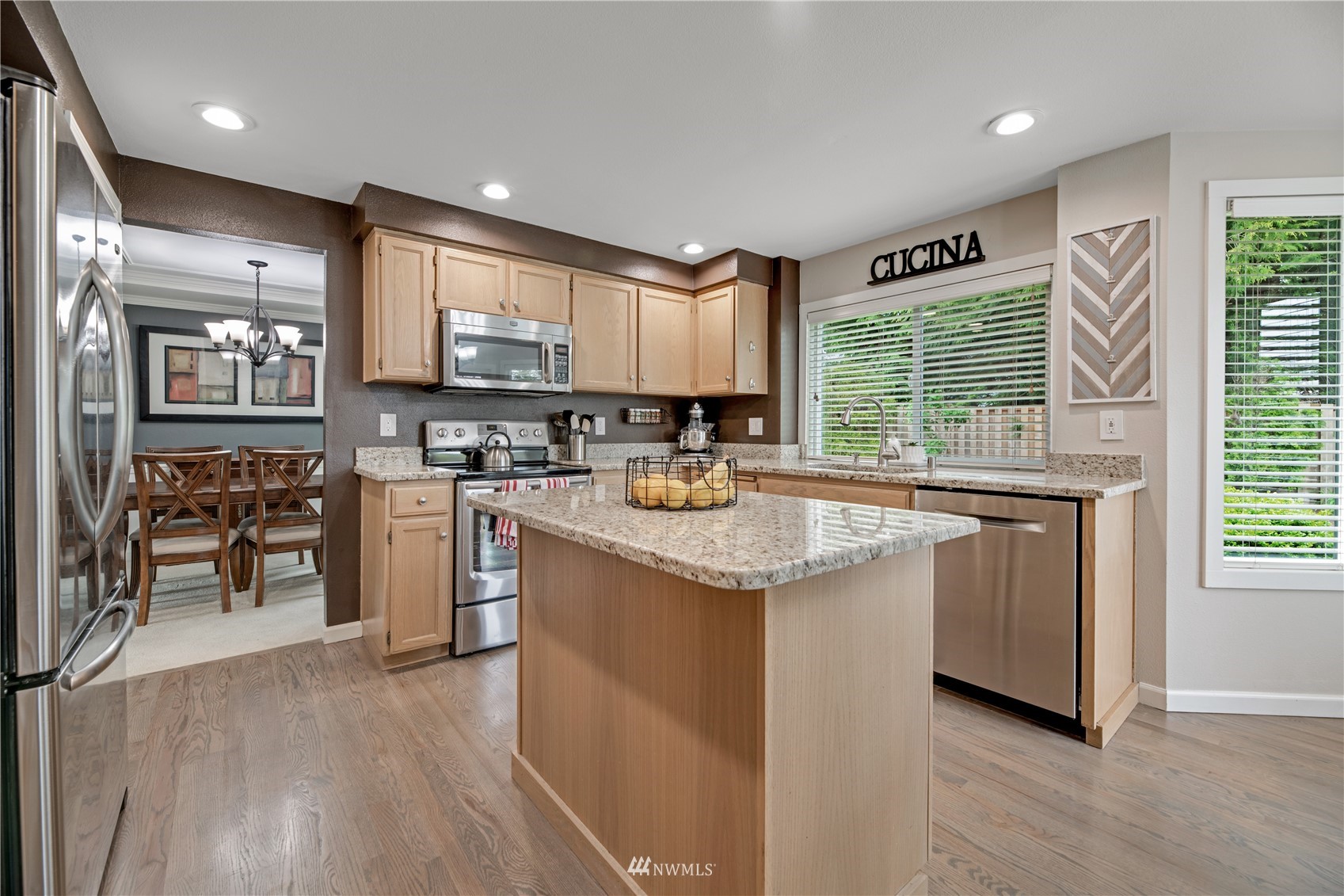 20909 33rd Avenue Southeast Bothell, WA 98021 - Photo 8 of 30 a kitchen with stainless steel appliances granite countertop sink stove top oven and cabinets