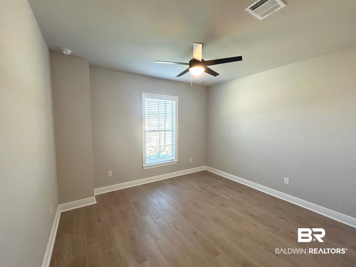 848 Sumter Loop Foley, AL 36535 - Photo 14 of 16 Empty room featuring wood-type flooring and ceiling fan