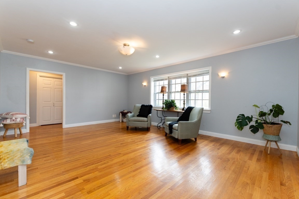 121 Lake Shore Road, Unit 2 Boston, MA 02135 - Photo 2 of 32 a living room with furniture and wooden floor