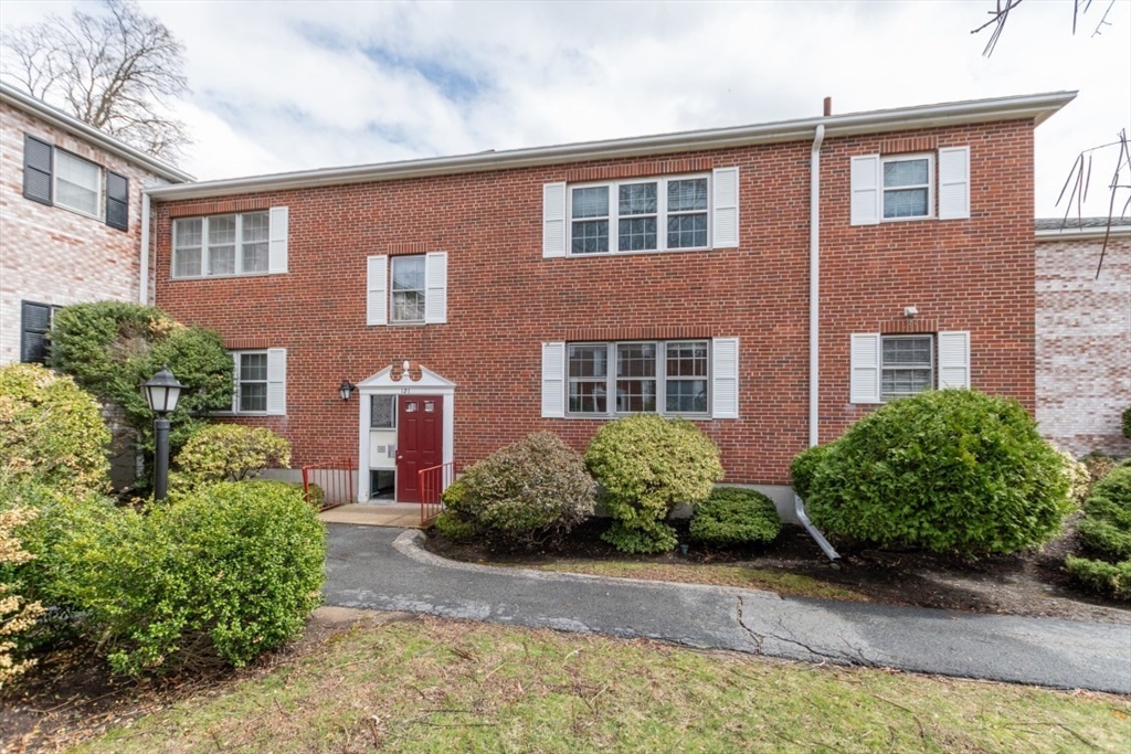 121 Lake Shore Road, Unit 2 Boston, MA 02135 - Photo 25 of 32 a front view of a house with garden