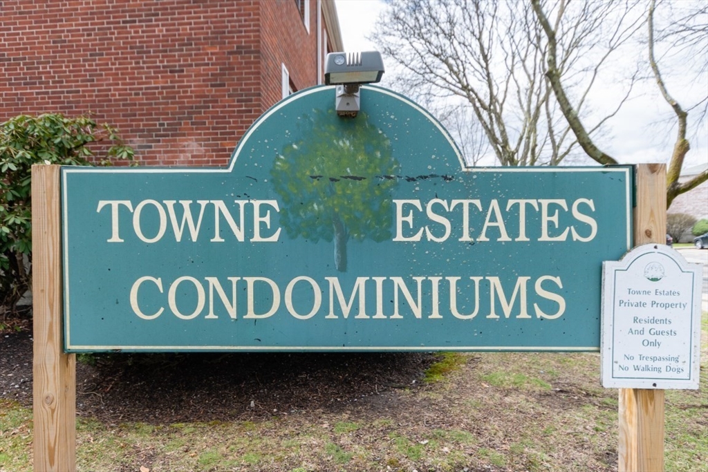 121 Lake Shore Road, Unit 2 Boston, MA 02135 - Photo 30 of 32 a sign broad on a brick wall