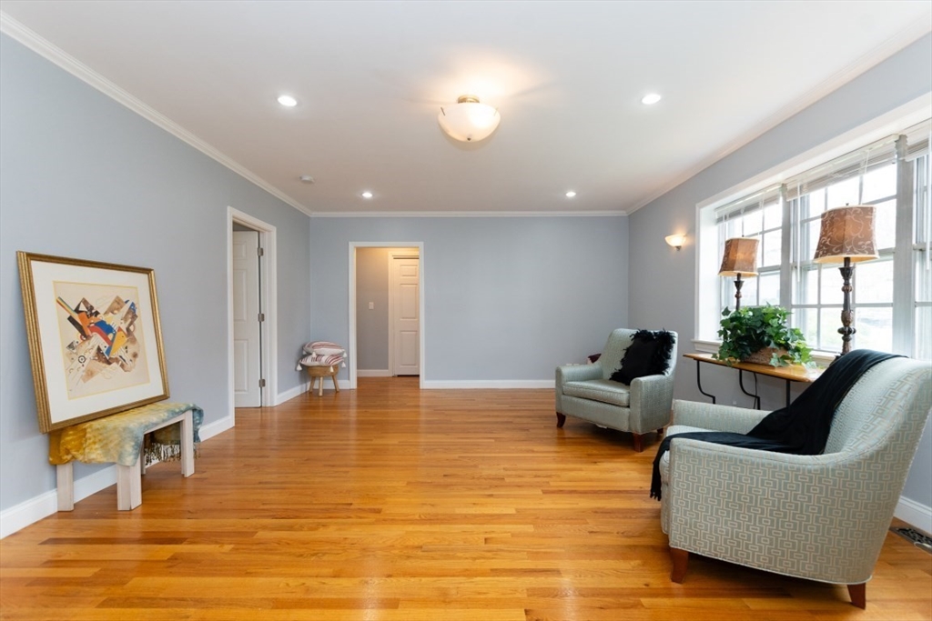 121 Lake Shore Road, Unit 2 Boston, MA 02135 - Photo 3 of 32 a living room with furniture and a large window