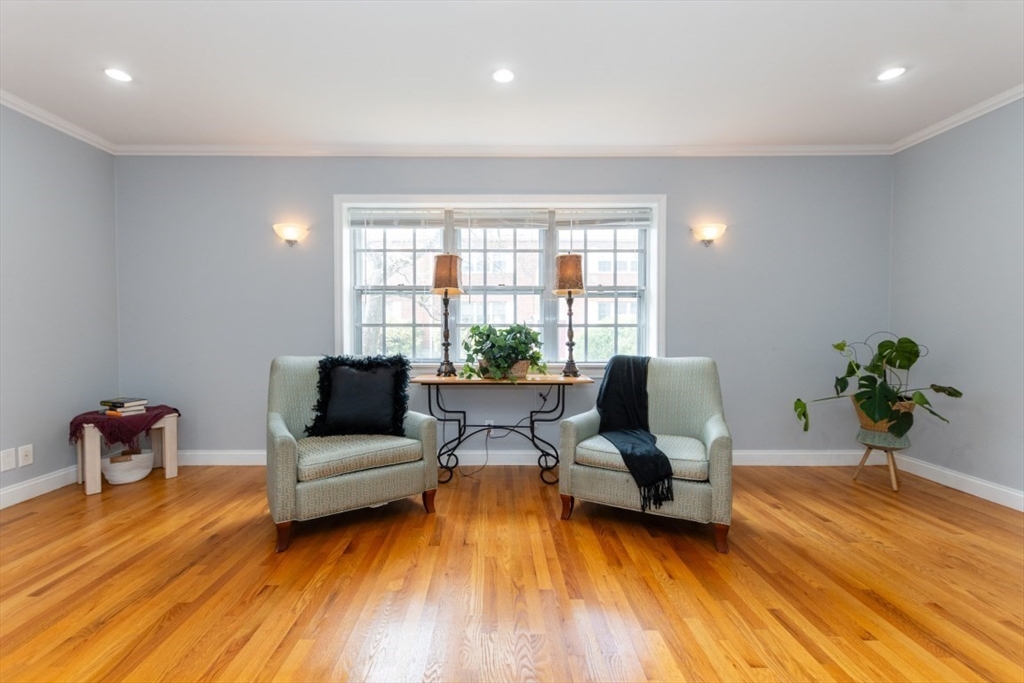 121 Lake Shore Road, Unit 2 Boston, MA 02135 - Photo 5 of 32 a living room with furniture and wooden floor