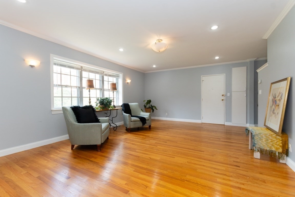 121 Lake Shore Road, Unit 2 Boston, MA 02135 - Photo 6 of 32 a living room with furniture and a window