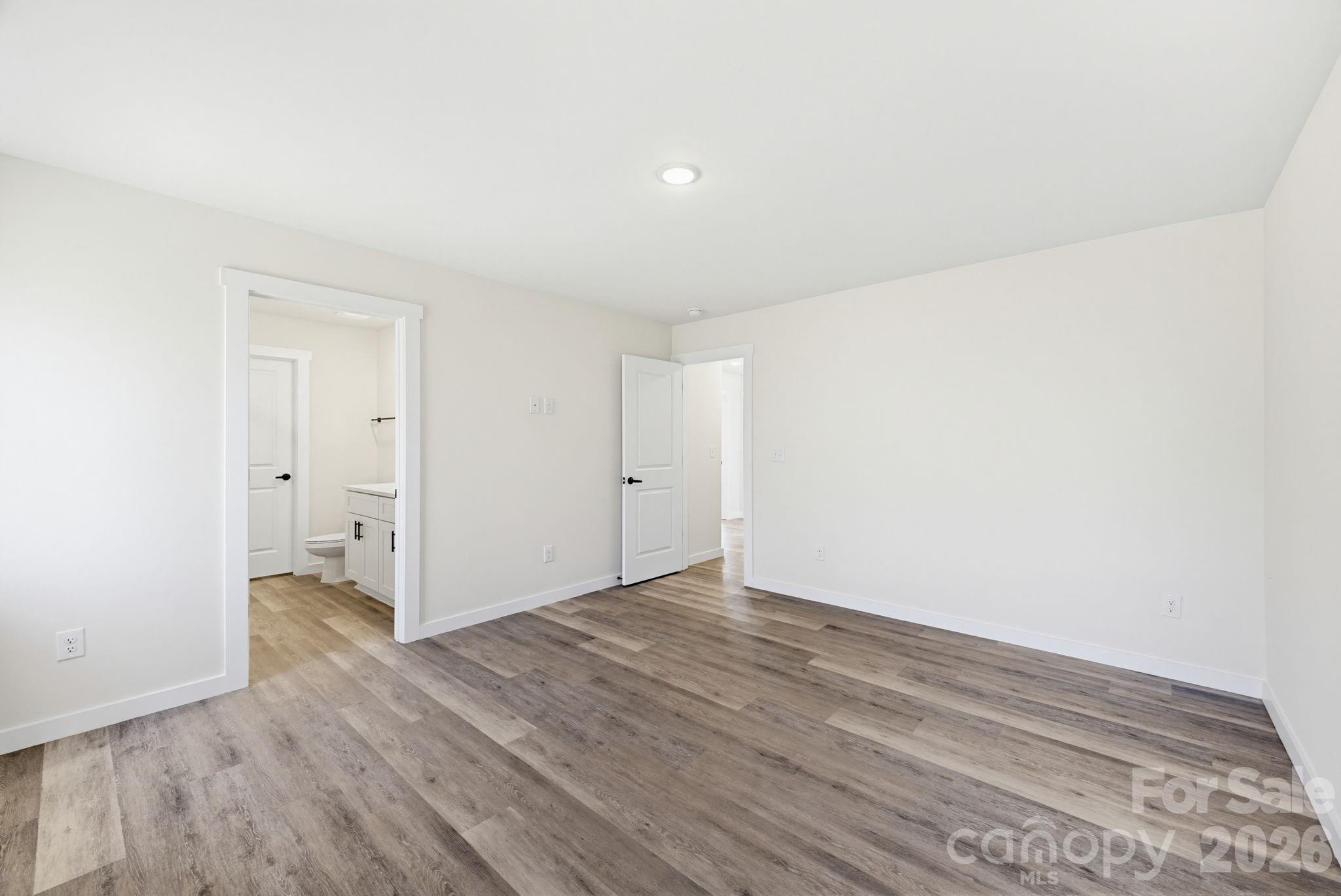 2332 Merts Way Hudson, NC 28638 - Photo 16 of 21 a view of an empty room and wooden floor