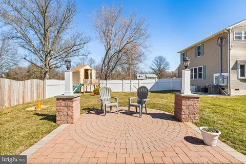 a view of a patio with a yard