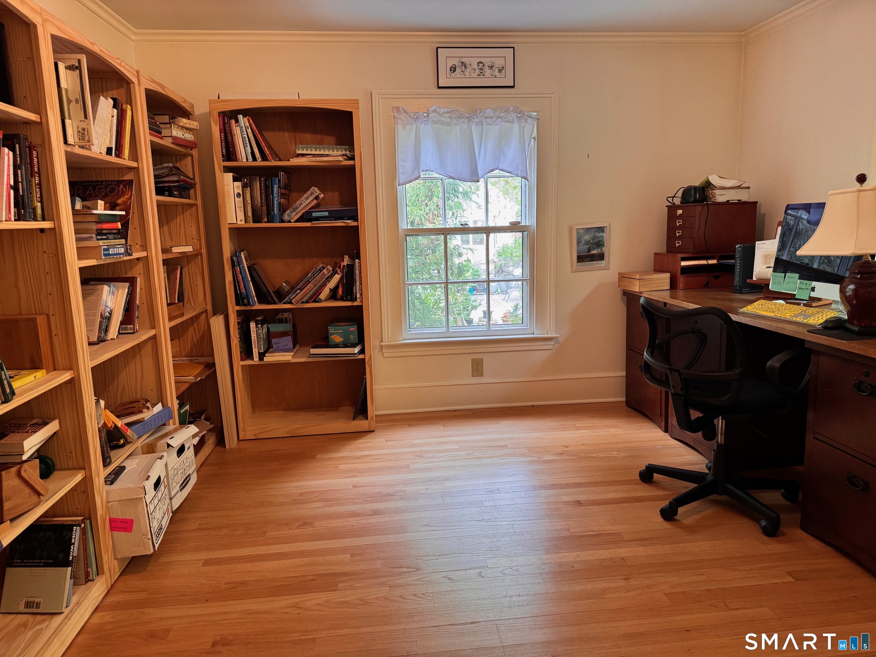 57 Mill Rock Road Hamden, CT 06517 - Photo 16 of 24 a view of a workspace with furniture and a window
