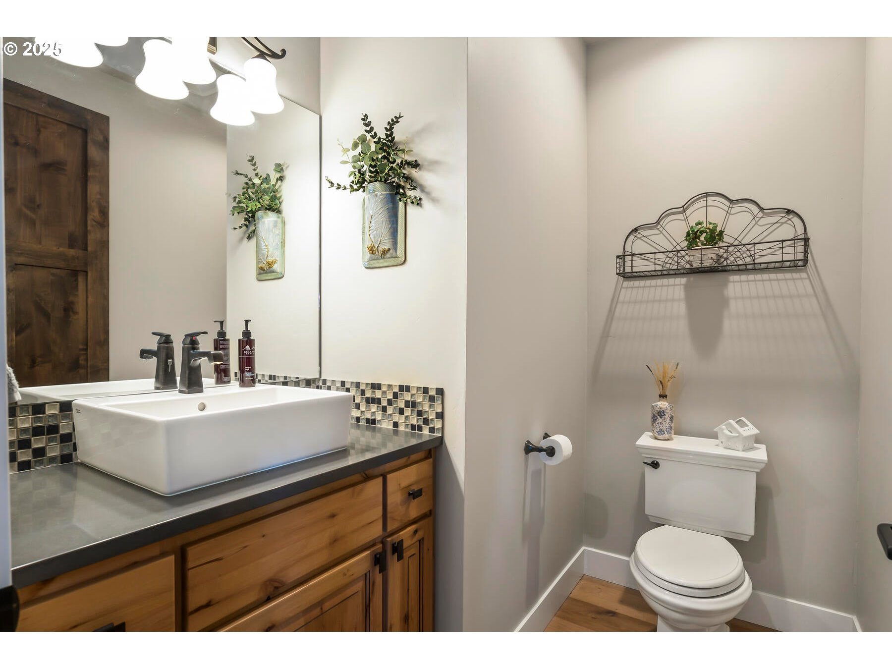 16368 South W Hat Rock Loop Powell Butte, OR 97753 - Photo 29 of 40 a bathroom with a sink a toilet and mirror