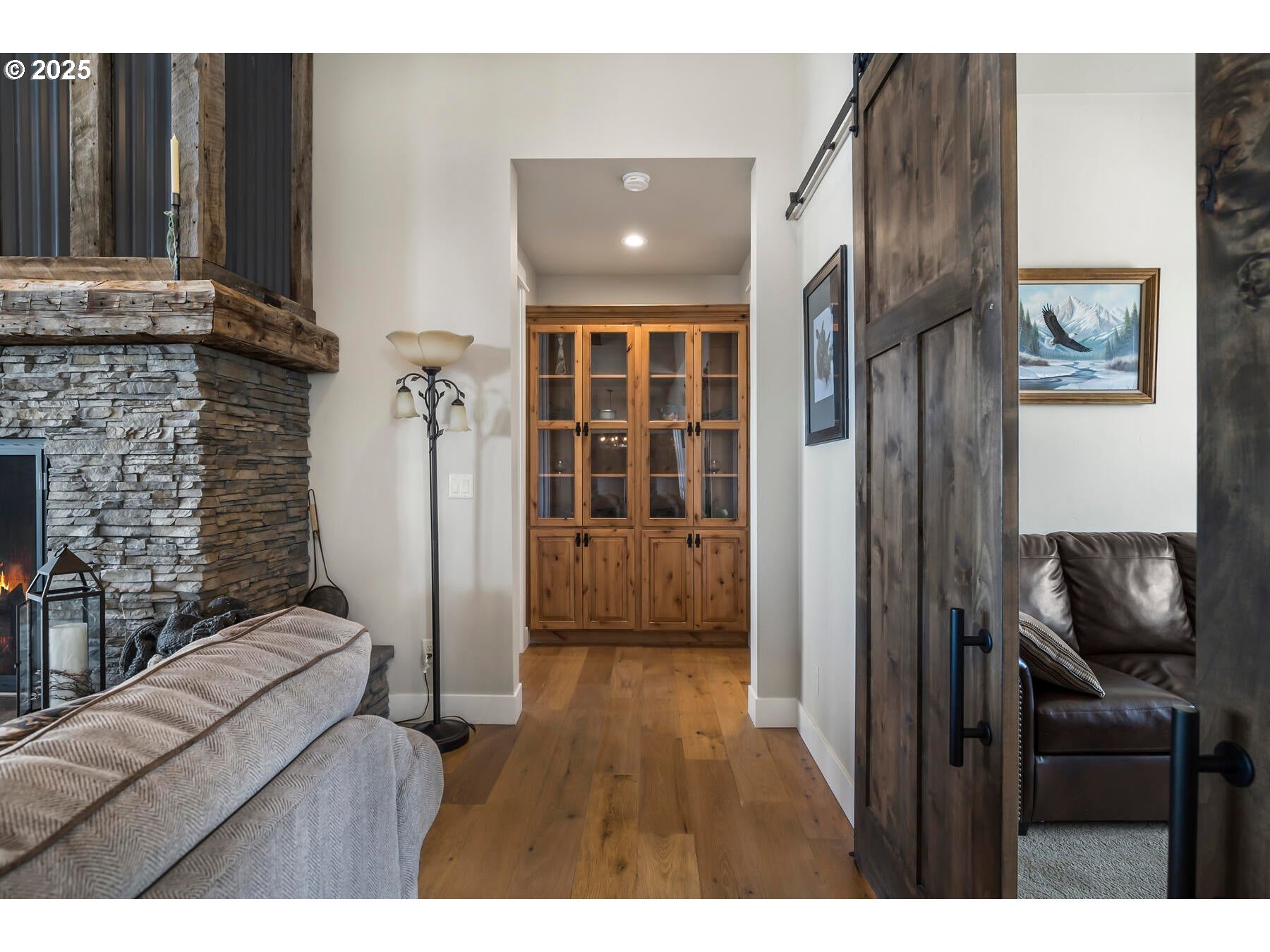 16368 South W Hat Rock Loop Powell Butte, OR 97753 - Photo 30 of 40 a living room with furniture and a fireplace