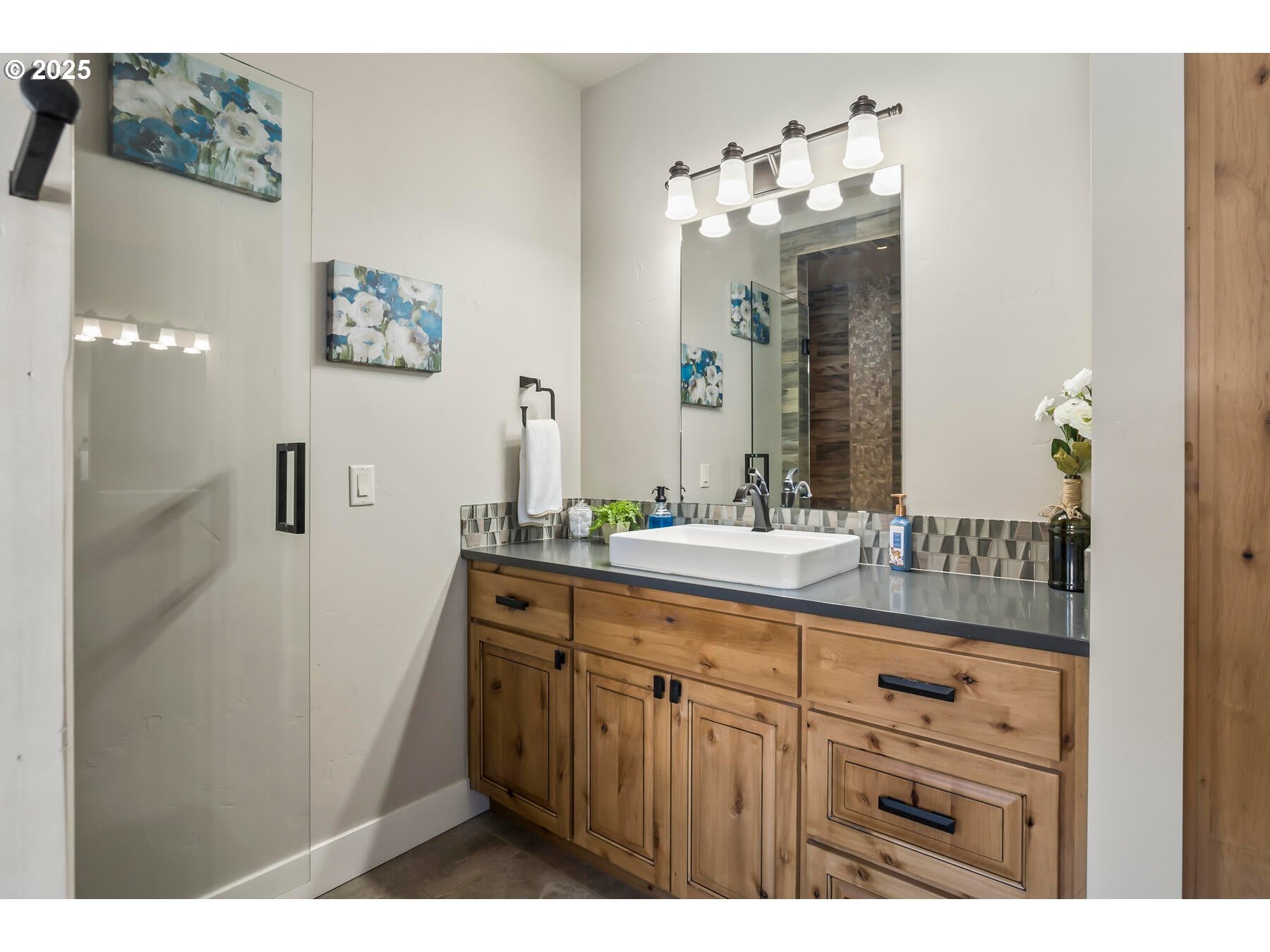 16368 South W Hat Rock Loop Powell Butte, OR 97753 - Photo 36 of 40 a bathroom with a sink vanity and a mirror