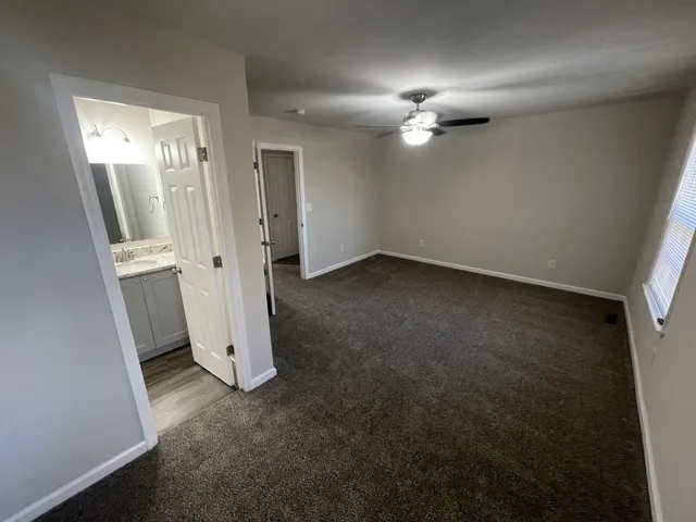 an empty room with a bathroom