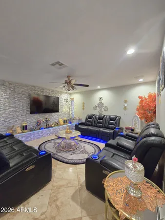 a kitchen with stainless steel appliances granite countertop a sink and a refrigerator