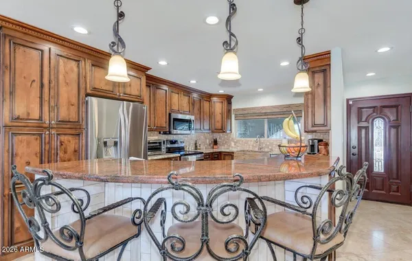 a kitchen with a sink stove top oven and cabinets
